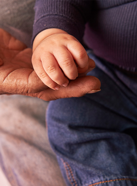 old hands touching new