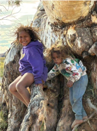 kids by a tree