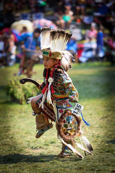 Boy in regalia dancing at powwow