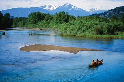 row of kids sitting on a bleacher