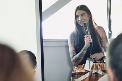 Image of woman speaking with microphone 